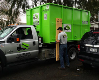 Dumpster Delivery Experts Pulling Boards Off Dumps